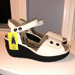 Fly London women’s off-white wedge sandal.
